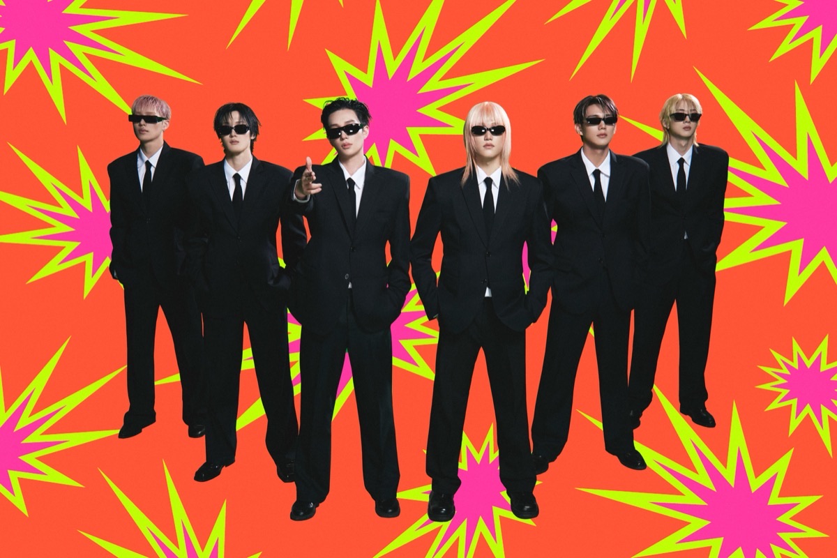 Foto conceptual oficial de P1Harmony para «BLOW UP»: los seis integrantes de pie, de traje negro y anteojos oscuros, sobre un fondo naranja con estallidos rosas y amarillos
