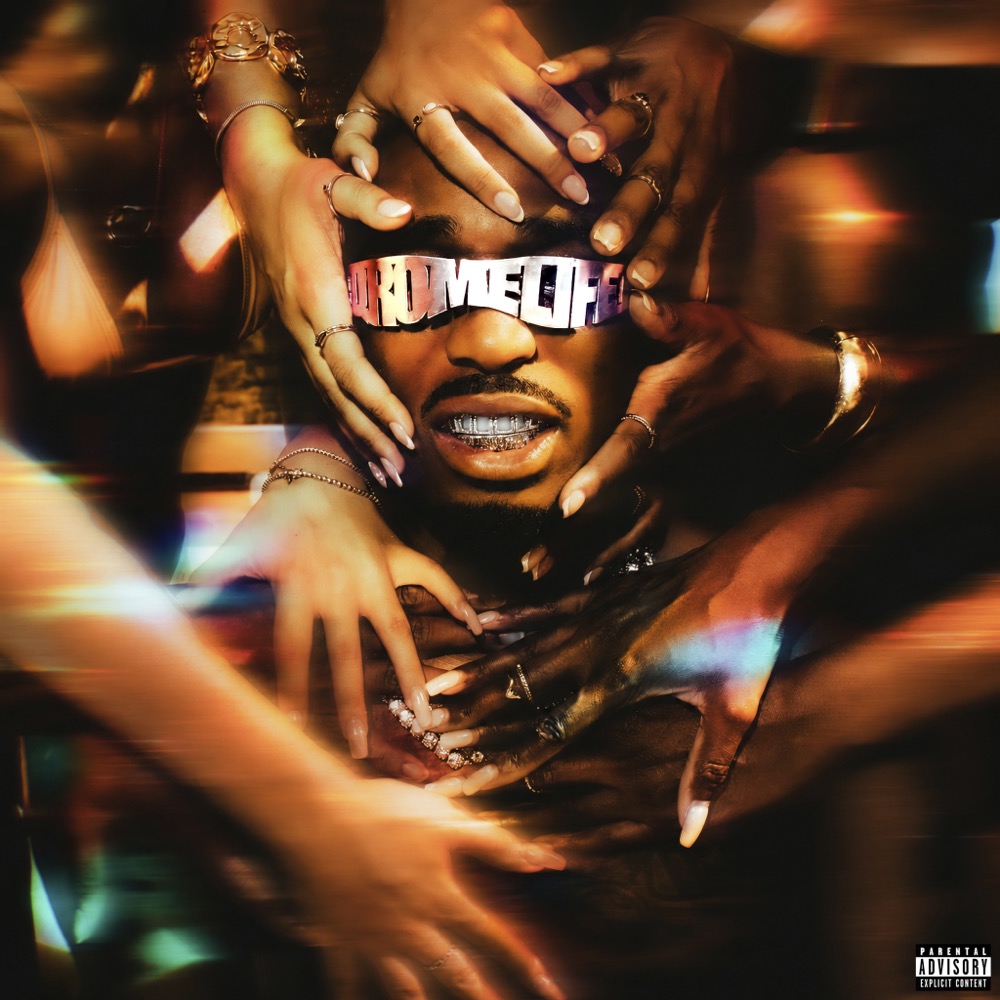 Portada del single Trance de Quavo: su cara con los anteojos QRÖMELIFE rodeada de varias manos con anillos y uñas largas, en tonos dorados